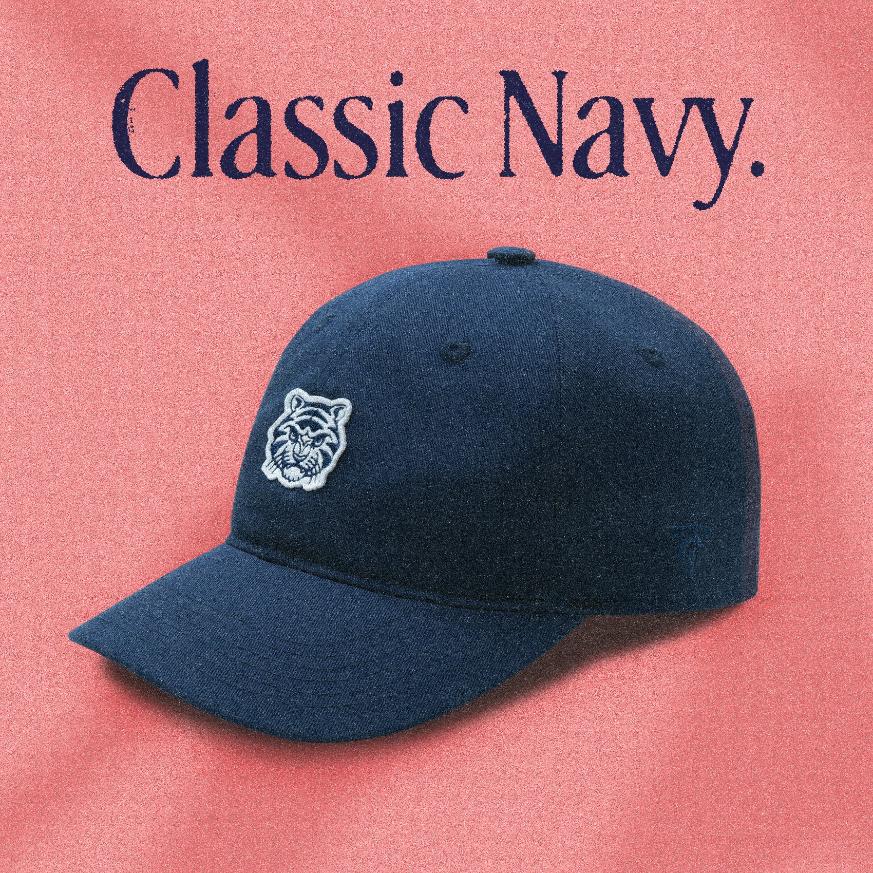 A navy blue strapback cap with a Tigerclaw logo embroidered on the front.