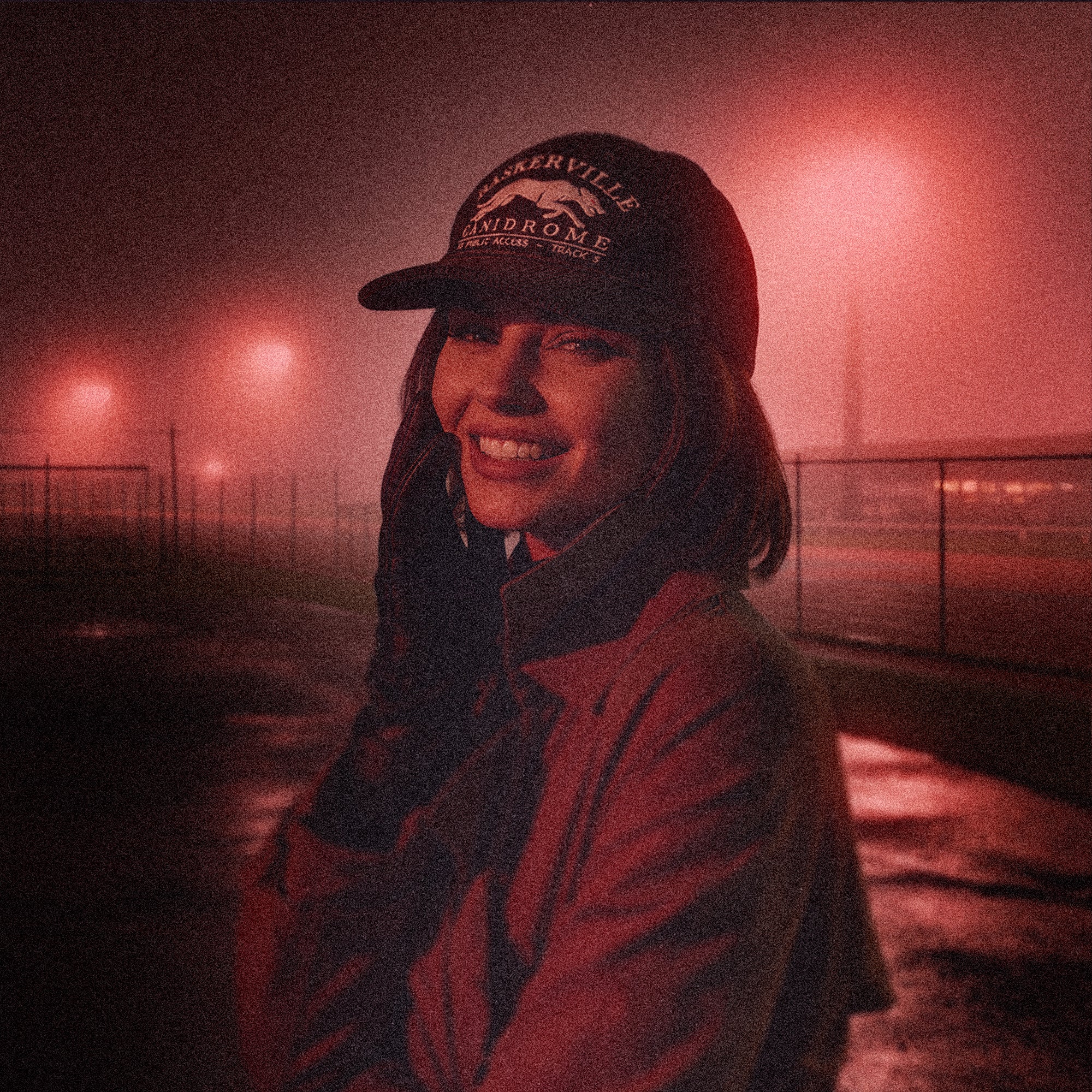 Person wearing the Tigerclaw Baskerville Canidrome corduroy cap in a foggy nighttime lifestyle campaign inspired by vintage greyhound racing culture