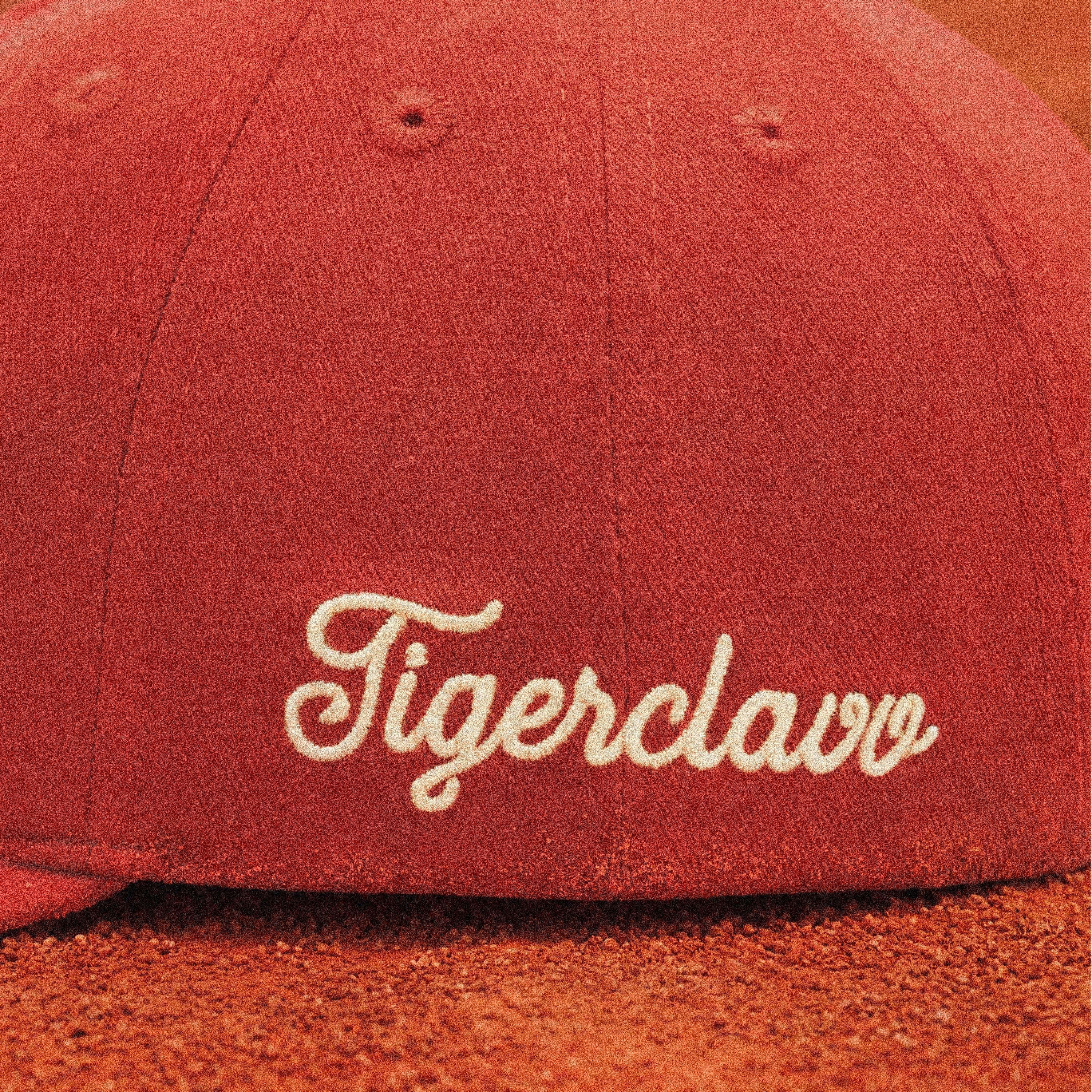 Finished with a cream script embroidery inspired by vintage tennis club insignias. Subtle, timeless and built to age alongside the cap.
