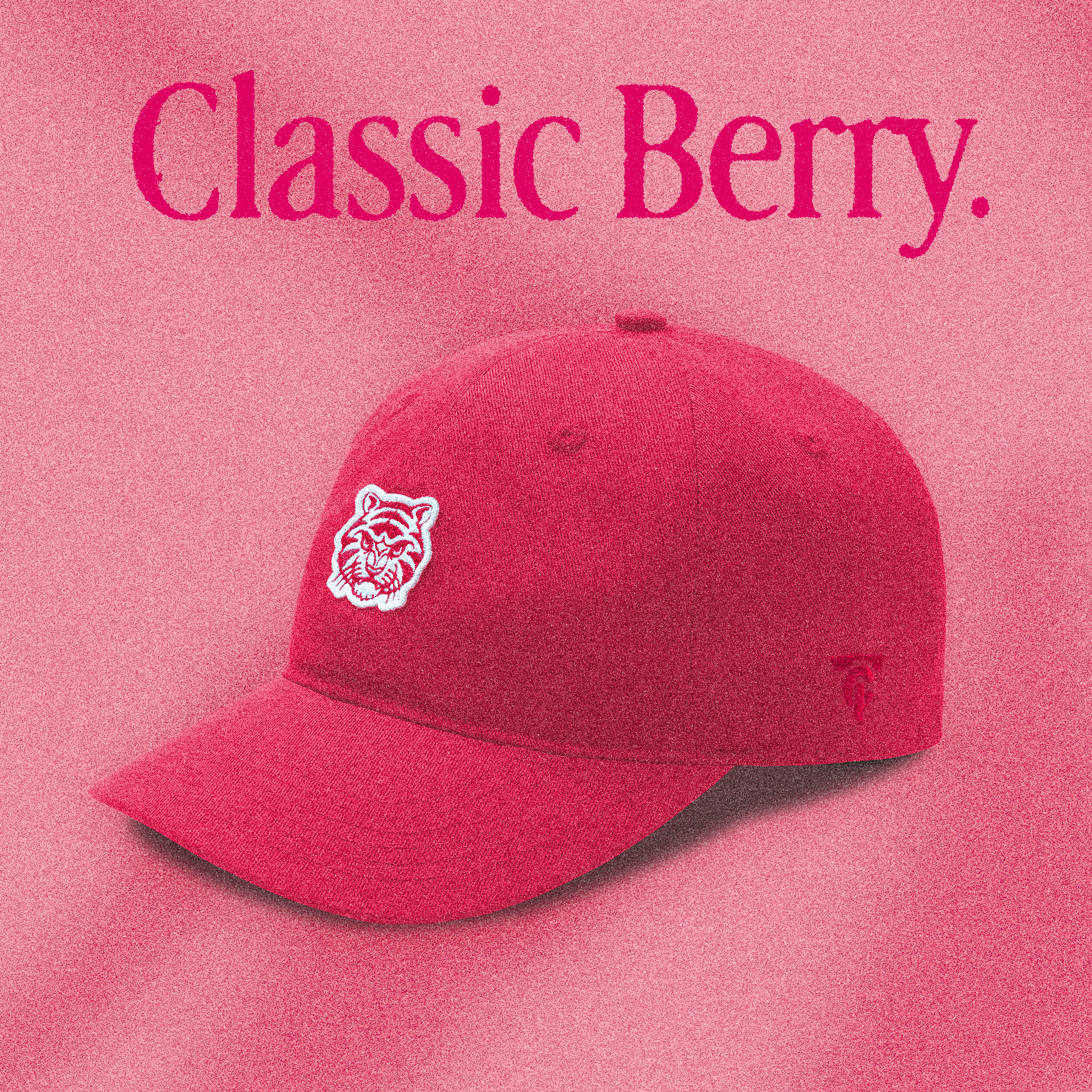 A red "Classic Berry" Tigerclaw strapback cap set against a matching pink-red background with bold serif text above and a circular "Available now" sticker in the corner.