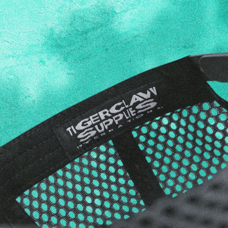 Close-up of Tigerclaw Wild Ride trucker cap interior strap with “Tigerclaw Supplies” branding.