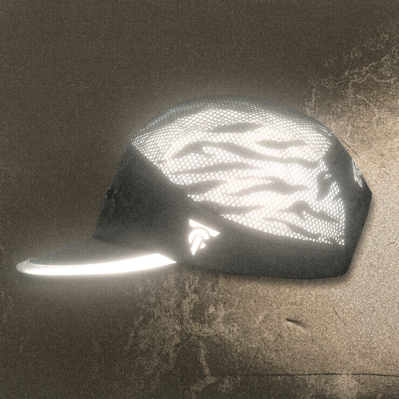 Side view of the Tigerclaw LUMEN8 reflective running cap glowing under light.